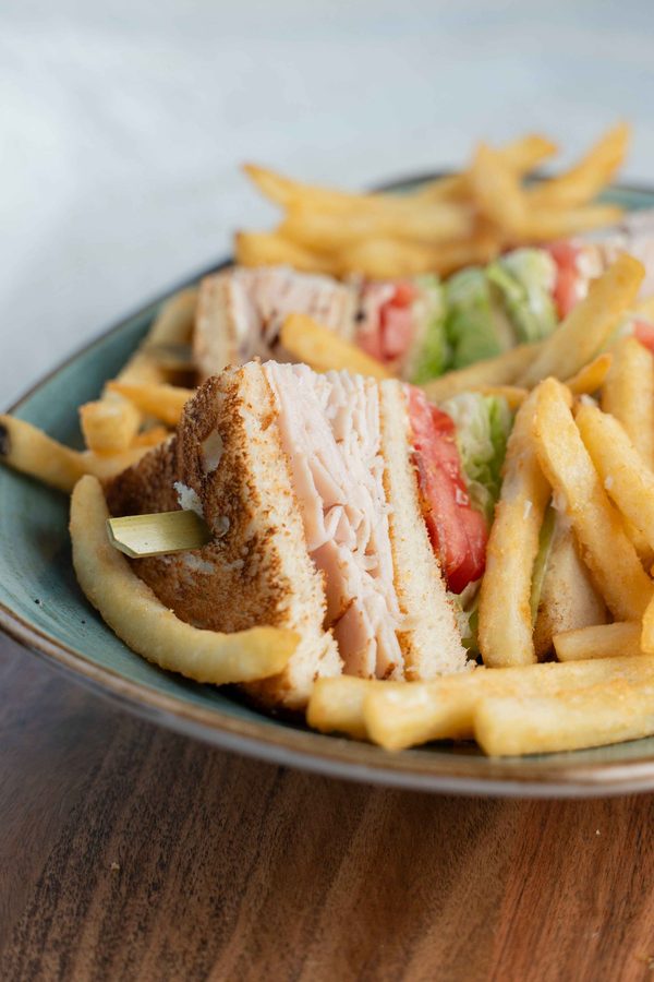 Belgian waffle with strawberries and syrup